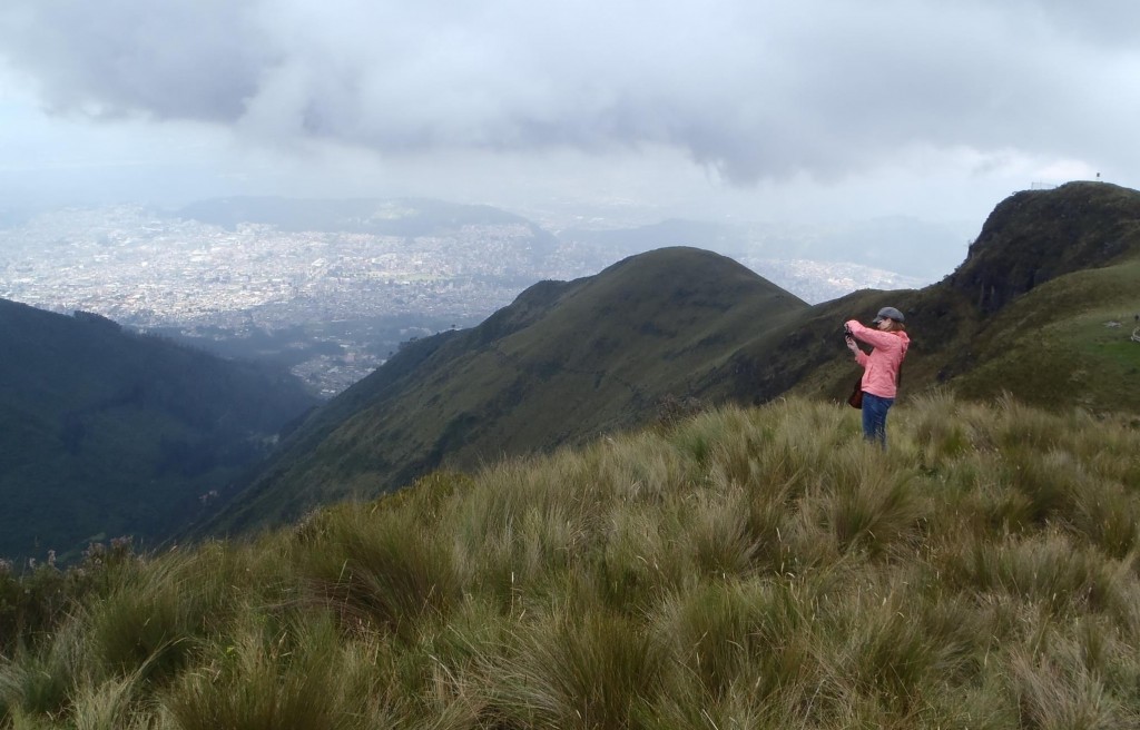 Joslin in the paramos, the ecosystem the provides the water to Quito, with Quito in the distance